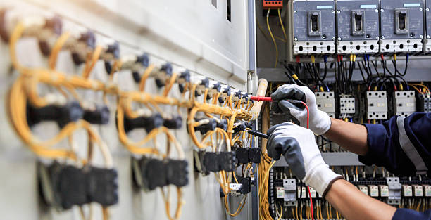 Professional Electrician technician working in Ives Estates, FL